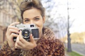 woman-holding-black-and-gray-camera-focus-photo-814822