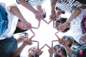 group-of-people-forming-star-using-their-hands-1116302