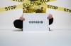 person-holding-covid-sign-3951600