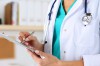 Female medicine doctor hand holding silver pen