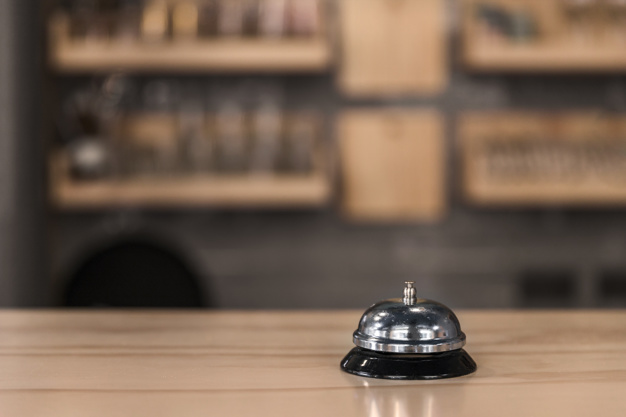 service-bell-wooden-counter_23-2147893097