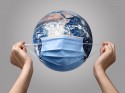 person-putting-medical-mask-earth – копія