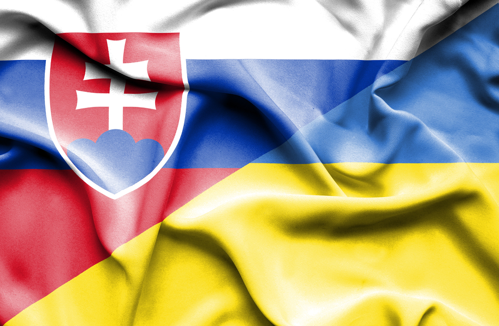 Waving flag of Ukraine and Slovak