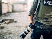 Man war journalist with camera