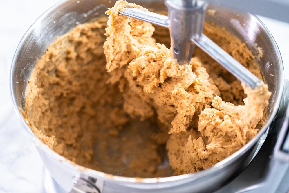 mixing-ingredients-standing-kitchen-mixer-bake-peanut-butter-cookies_198639-90200