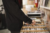 close-up-young-man-looking-vinyls-store