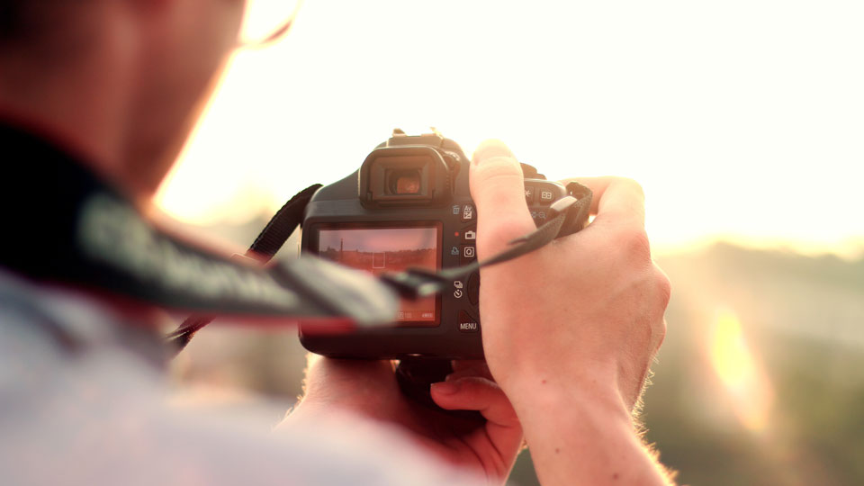 trans-history_film-competition_man-camera-taking-photo-photographer_960x540