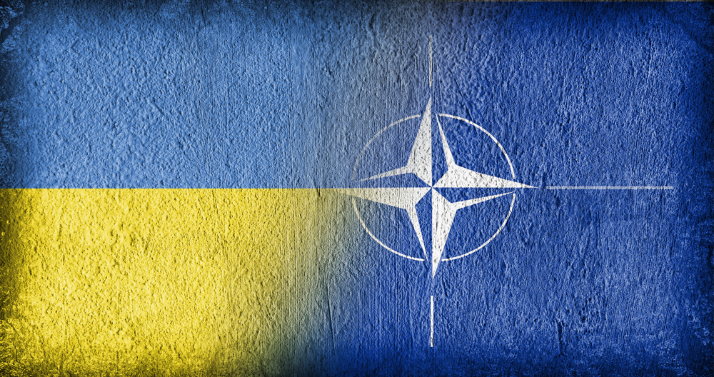 Ukrainian and NATO flag on concrete