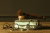 Gavel With Books On Old Wooden Desk