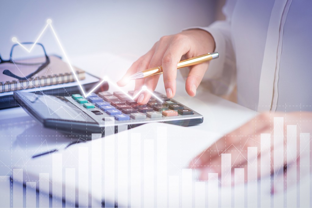 accountant-calculating-profit-with-financial-analysis-graphs (1)